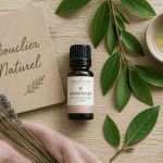 huile essentielle ravintsara bienfaits flacon et feuilles camphrier